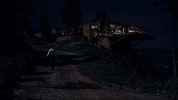 Movie still from “North by Northwest” (1959), directed by Alfred Hitchcock – A man walking down a dirt road at night; Extreme Wide shot, Low angle