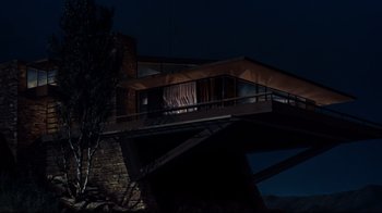 Movie still from “North by Northwest” (1959), directed by Alfred Hitchcock – A building with a balcony at the top of a bridge; Extreme Wide shot, Low angle