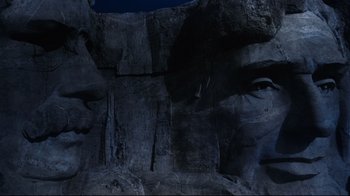 Movie still from “North by Northwest” (1959), directed by Alfred Hitchcock – The face of an old man in the middle of a rock face; Extreme Close Up shot, Low angle