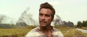 Movie still from “O Brother, Where Art Thou?” (2000), directed by Joel Coen – A person wearing a striped shirt; Close Up shot, Low angle