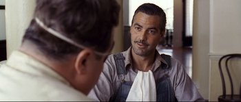 Movie still from “O Brother, Where Art Thou?” (2000), directed by Joel Coen – A person looking at a mirror; Close Up shot, Over the shoulder angle