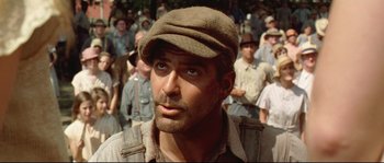 Movie still from “O Brother, Where Art Thou?” (2000), directed by Joel Coen – A person wearing a hat; Close Up shot, Low angle