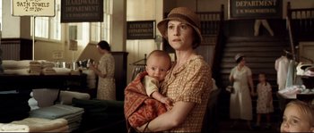 Movie still from “O Brother, Where Art Thou?” (2000), directed by Joel Coen – A woman holding a baby in her arms; Medium shot, High angle