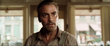 Movie still from “O Brother, Where Art Thou?” (2000), directed by Joel Coen – A person with a beard; Close Up shot, Over the shoulder angle