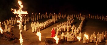 Movie still from “O Brother, Where Art Thou?” (2000), directed by Joel Coen – Many people dressed in white and red clothes; Extreme Wide shot, High angle