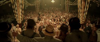 Movie still from “O Brother, Where Art Thou?” (2000), directed by Joel Coen – A large group of people are gathered in a large room; Wide shot, High angle