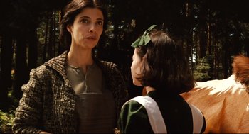 Movie still from “Pan's Labyrinth” (2006), directed by Guillermo del Toro – A woman standing next to another woman in a forest; Close Up shot, Over the shoulder angle