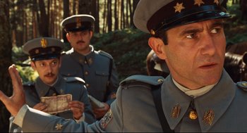 Movie still from “Pan's Labyrinth” (2006), directed by Guillermo del Toro – A group of men in uniform standing next to each other in a forest; Close Up shot, Low angle