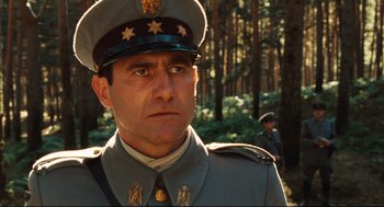 Movie still from “Pan's Labyrinth” (2006), directed by Guillermo del Toro – A person wearing a uniform; Close Up shot, Low angle