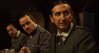 Movie still from “Pan's Labyrinth” (2006), directed by Guillermo del Toro – Two men in military uniforms looking at the camera; Close Up shot, Over the shoulder angle
