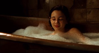 Movie still from “Pan's Labyrinth” (2006), directed by Guillermo del Toro – A young girl is taking a bath in a tub; Close Up shot, High angle