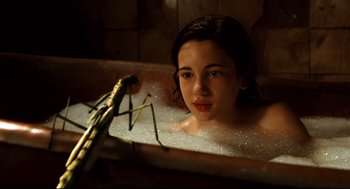 Movie still from “Pan's Labyrinth” (2006), directed by Guillermo del Toro – A woman in a bath tub with a stick in it; Close Up shot, High angle