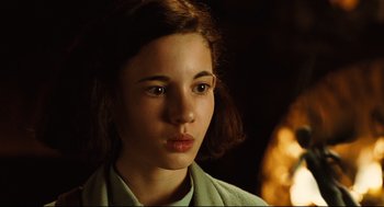 Movie still from “Pan's Labyrinth” (2006), directed by Guillermo del Toro – A young woman is looking into the camera; Close Up shot, High angle
