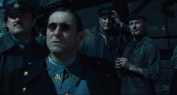 Movie still from “Pan's Labyrinth” (2006), directed by Guillermo del Toro – A group of men standing next to each other in a room; Close Up shot, Low angle