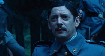 Movie still from “Pan's Labyrinth” (2006), directed by Guillermo del Toro – A person wearing a uniform; Close Up shot, Low angle