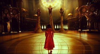 Movie still from “Pan's Labyrinth” (2006), directed by Guillermo del Toro – A little girl in a red coat standing in a room; Extreme Wide shot, High angle