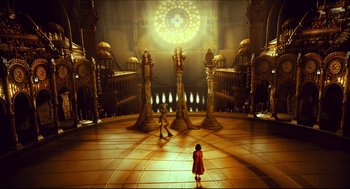Movie still from “Pan's Labyrinth” (2006), directed by Guillermo del Toro – Two children are standing in an elaborate room; Extreme Wide shot, High angle