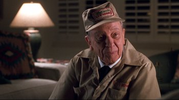 Movie still from “Pleasantville” (1998), directed by Gary Ross – An older man wearing a hat and a jacket; Close Up shot, Over the shoulder angle