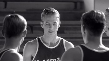 Movie still from “Pleasantville” (1998), directed by Gary Ross – A young man in a black and white photo looking to his left; Close Up shot, Over the shoulder angle