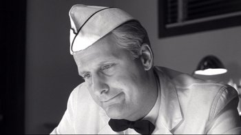 Movie still from “Pleasantville” (1998), directed by Gary Ross – An older man wearing a sailor's hat and bow tie; Close Up shot, Low angle