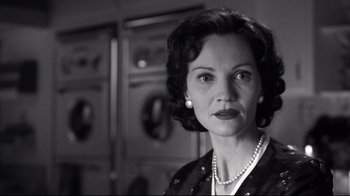 Movie still from “Pleasantville” (1998), directed by Gary Ross – A woman in a black and white photo looking at the camera; Close Up shot, Low angle