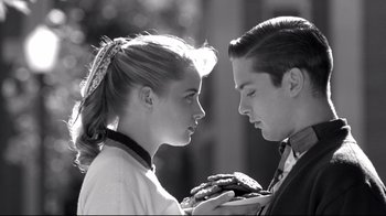 Movie still from “Pleasantville” (1998), directed by Gary Ross – A man and a woman are looking at each other; Close Up shot, Over the shoulder angle
