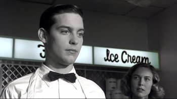 Movie still from “Pleasantville” (1998), directed by Gary Ross – A man in a white shirt wearing a black bow tie; Close Up shot, Over the shoulder angle