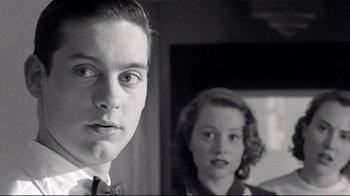Movie still from “Pleasantville” (1998), directed by Gary Ross – A man and a woman are looking at the camera; Close Up shot, Low angle