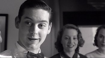 Movie still from “Pleasantville” (1998), directed by Gary Ross – A man and a woman standing next to each other; Close Up shot, Low angle