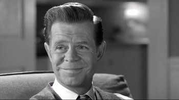 Movie still from “Pleasantville” (1998), directed by Gary Ross – An older man wearing a suit and tie; Close Up shot, Over the shoulder angle