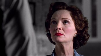 Movie still from “Pleasantville” (1998), directed by Gary Ross – An older woman looking up into the air; Close Up shot, Low angle