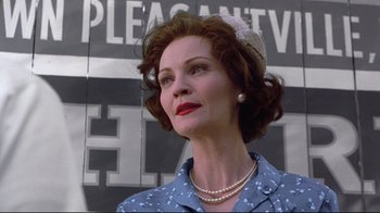 Movie still from “Pleasantville” (1998), directed by Gary Ross – An older woman wearing pearls and a hat; Close Up shot, Low angle