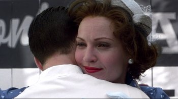 Movie still from “Pleasantville” (1998), directed by Gary Ross – A woman hugging a man in a white shirt; Close Up shot, Low angle