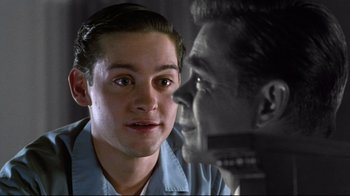 Movie still from “Pleasantville” (1998), directed by Gary Ross – A young man and an older man face to face; Close Up shot, Over the shoulder angle