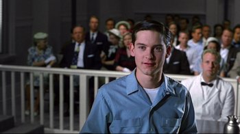 Movie still from “Pleasantville” (1998), directed by Gary Ross – A man standing in front of a crowd; Medium shot, Over the shoulder angle