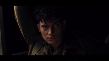 Movie still from “Dunkirk” (2017), directed by Christopher Nolan – A person wearing a jacket; Close Up shot, Low angle