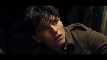 Movie still from “Dunkirk” (2017), directed by Christopher Nolan – A person wearing a jacket; Close Up shot, High angle