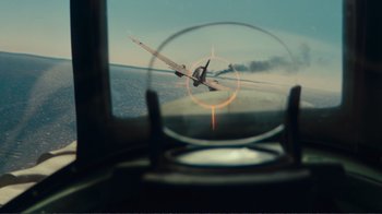 Movie still from “Dunkirk” (2017), directed by Christopher Nolan – A view of a plane flying through a window; Wide shot, High angle