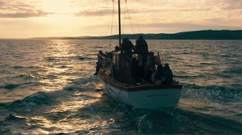 Movie still from “Dunkirk” (2017), directed by Christopher Nolan – A group of people on a boat in the water; Extreme Wide shot, High angle