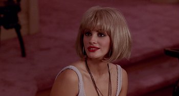 Movie still from “Pretty Woman” (1990), directed by Garry Marshall – A woman with blonde hair wearing a white top; Close Up shot, Over the shoulder angle
