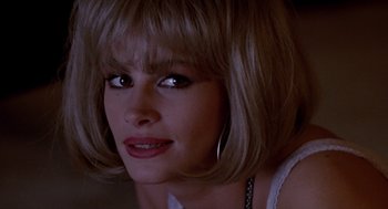 Movie still from “Pretty Woman” (1990), directed by Garry Marshall – A person wearing a white shirt; Close Up shot, Over the shoulder angle