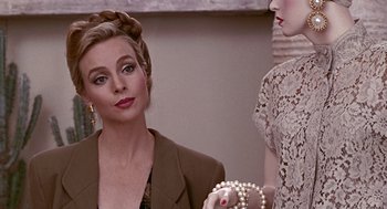 Movie still from “Pretty Woman” (1990), directed by Garry Marshall – A woman in a brown jacket and a woman in a white lace dress; Close Up shot, Over the shoulder angle