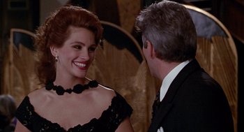 Movie still from “Pretty Woman” (1990), directed by Garry Marshall – A man and a woman in a black dress; Close Up shot, Over the shoulder angle