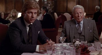 Movie still from “Pretty Woman” (1990), directed by Garry Marshall – Two men sitting at a table in a restaurant; Medium shot, Over the shoulder angle