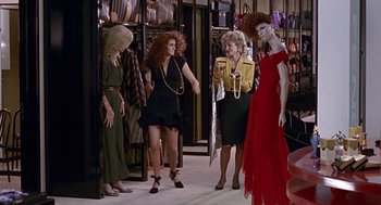 Movie still from “Pretty Woman” (1990), directed by Garry Marshall – A group of women standing next to each other in a store; Wide shot, Over the shoulder angle