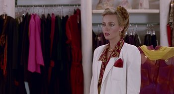 Movie still from “Pretty Woman” (1990), directed by Garry Marshall – A woman in a white jacket and a red tie; Medium shot, Over the shoulder angle