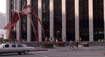 Movie still from “Pretty Woman” (1990), directed by Garry Marshall – A group of people walking in front of a large building; Extreme Wide shot, High angle