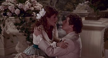 Movie still from “Pretty Woman” (1990), directed by Garry Marshall – A man and a woman are dancing together; Medium shot, Over the shoulder angle