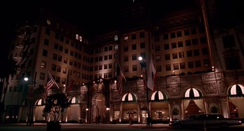 Movie still from “Pretty Woman” (1990), directed by Garry Marshall – A large building with many windows at night time; Extreme Wide shot, Low angle