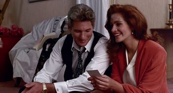 Movie still from “Pretty Woman” (1990), directed by Garry Marshall – A man and a woman sitting next to each other; Medium shot, Over the shoulder angle